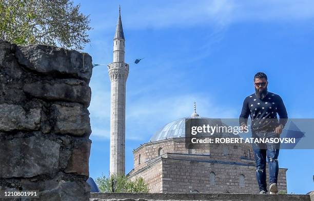 Man walks in front of the Mustafa Pasha's Mosque in Skopje on April 23 on the eve of the Muslims' holy month of Ramadan that falls on April 24. - The...