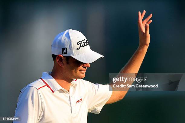 Brendan Steele waves to the gallery on the 18th green during the third round of the 93rd PGA Championship at the Atlanta Athletic Club on August 13,...