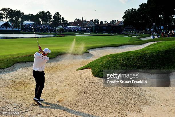 Brendan Steele plays a bunker shot on the 18th hole during the third round of the 93rd PGA Championship at the Atlanta Athletic Club on August 13,...