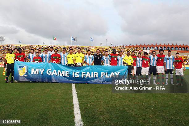 Players of Argentina and Portugal pose behind a banner reading 'My game is Fair Play' before the FIFA U-20 World Cup 2011 quarter final match between...