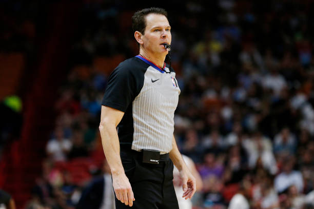 Referee Mark Ayotte looks on during the first half between the Miami Heat and the Minnesota Timberwolves at American Airlines Arena on February 26,...