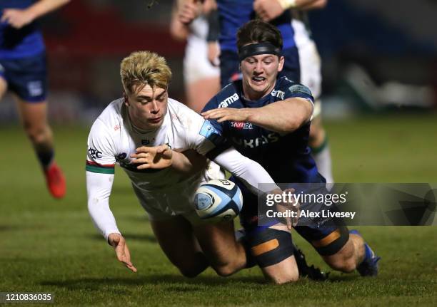 Ben Curry of Sale Sharks and Ollie Hassell Collins of London Irish chase the ball during the Gallagher Premiership Rugby match between Sale Sharks...