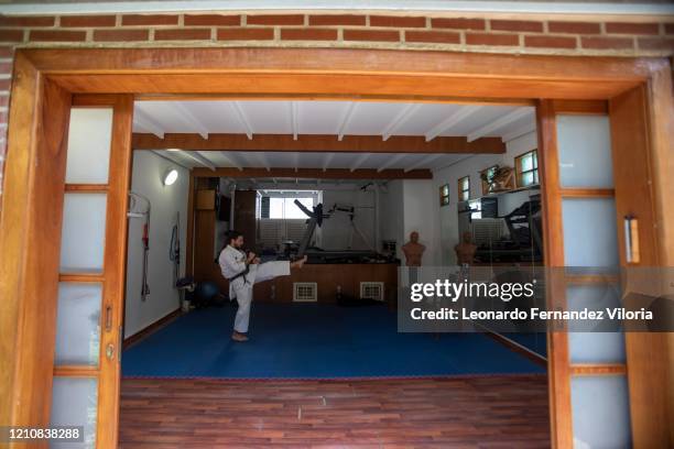 Venezuelan Karateka Antonio Jose Diaz Fernandez teaches online karate lessons from his dojo during COVID-19 lockdown on April 23, 2020 in Caracas,...