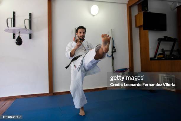 Venezuelan Karateka Antonio Jose Diaz Fernandez teaches online karate lessons from his dojo during COVID-19 lockdown on April 23, 2020 in Caracas,...