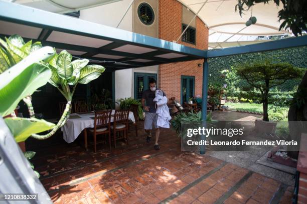 Venezuelan Karateka Antonio Jose Diaz Fernandez walks through his backyard to his little training dojo during COVID-19 lockdown on April 23, 2020 in...