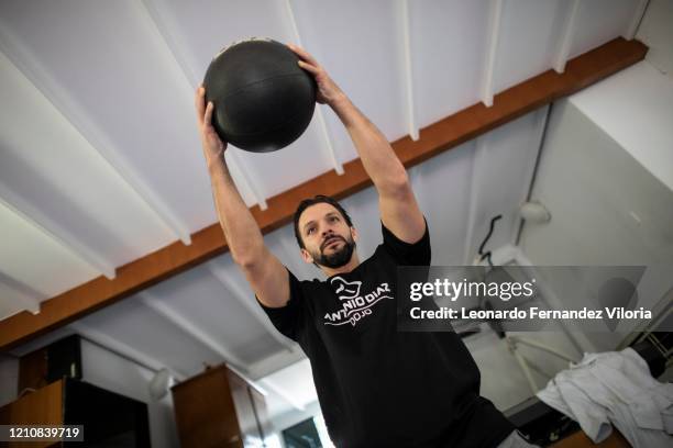 Venezuelan Karateka Antonio Jose Diaz Fernandez warms up a bit before training with a medicine ball during COVID-19 lockdown on April 22, 2020 in...