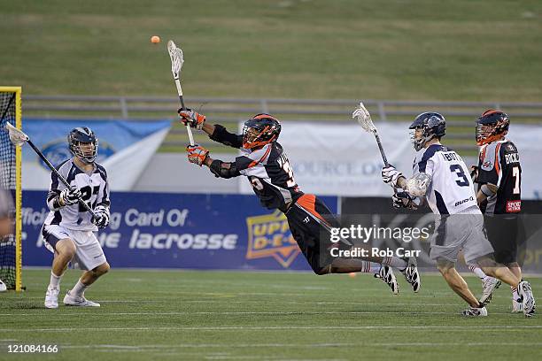 Nate Watkins of the Denver Outlaws passes the ball against the Chesapeake Bayhawks during the first half at Navy-Marine Corps Memorial Stadium on...