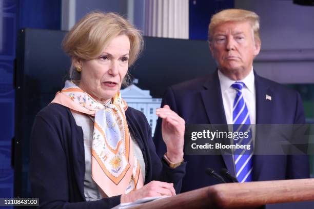 President Donald Trump, right, listens to Deborah Birx, coronavirus response coordinator, as she speaks during a news conference in the White House...