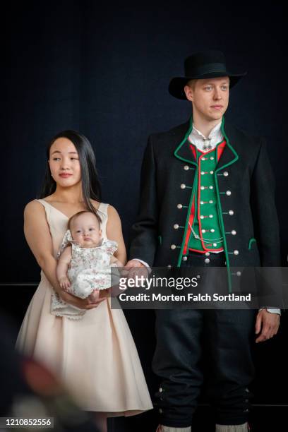 proud mom and dad with baby in bergen, norway - bunad stock pictures, royalty-free photos & images