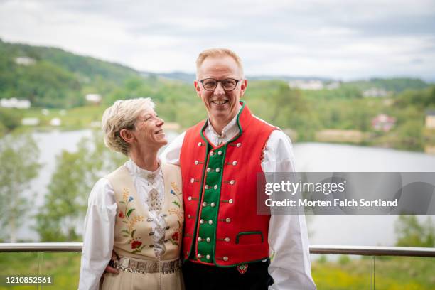 lovely couple wearing bunads, traditional norwegian outfit - bunad stock-fotos und bilder