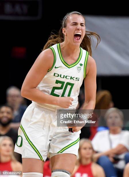 Sabrina Ionescu of the Oregon Ducks reacts after a teammate hit a 3-pointer against the Utah Utes during the Pac-12 Conference women’s basketball...