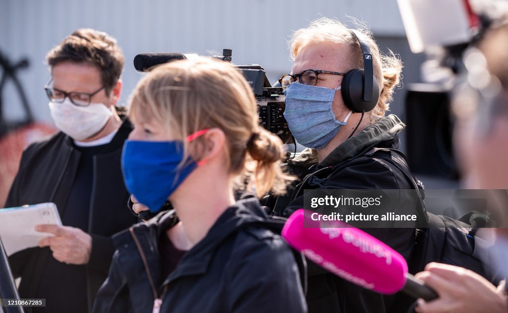 Mask Reporters Reporters wearing masks in front of their faces are on duty during ...