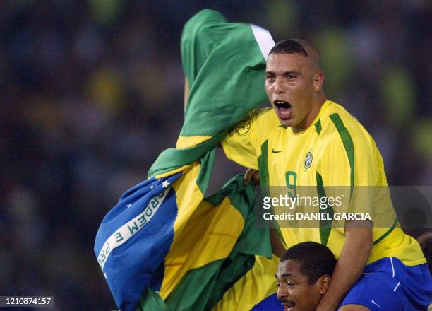 Brazil's forward Ronaldo celebrates, with tears in his eyes, after Brazil won 2-0 against Germany in match 64 of the 2002 FIFA World Cup Korea Japan...