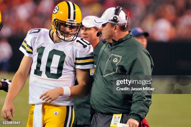 Quarterback Matt Flynn talks with head coach Mike McCarthy of the Green Bay Packers during the second quarter against the Cleveland Browns at...