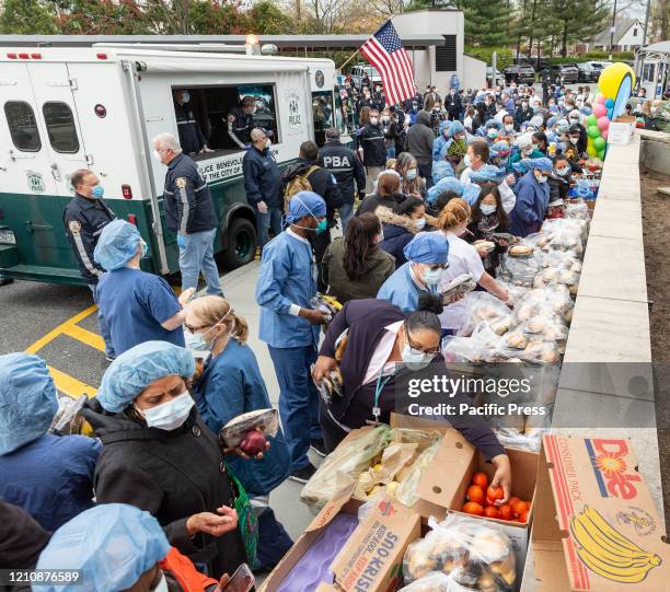 Nurses, doctors and staff pick up food brought by NYC Police Benevolent Association to thank staff at LIJMC. President of NYC Police Benevolent...