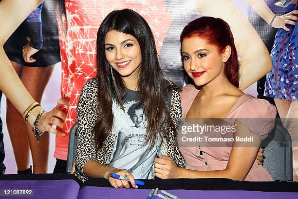 Actress Victoria Justice and Ariana Grande attend the CD signing for "Victorious: Music From The Hit TV Show" held at Walmart on August 13, 2011 in...