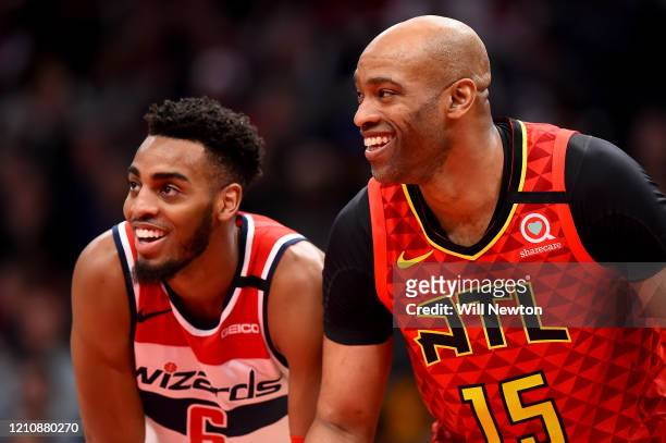 Troy Brown Jr. #6 of the Washington Wizards and Vince Carter of the Atlanta Hawks speak during the second half at Capital One Arena on March 06, 2020...
