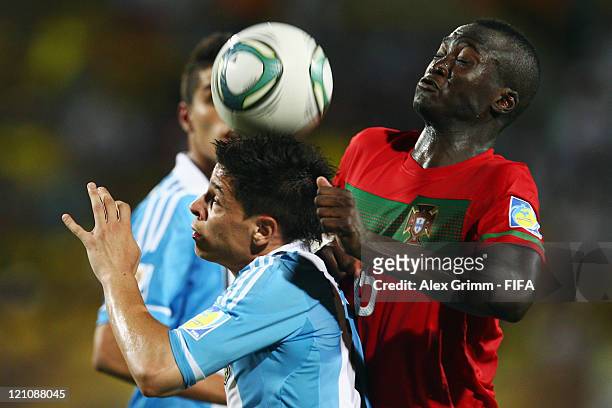 Juan Iturbe of Argentina is challenged by Danilo of Portugal during the FIFA U-20 World Cup 2011 quarter final match between Portugal and Argentina...