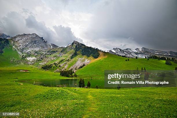 lac des confins - la clusaz stock pictures, royalty-free photos & images