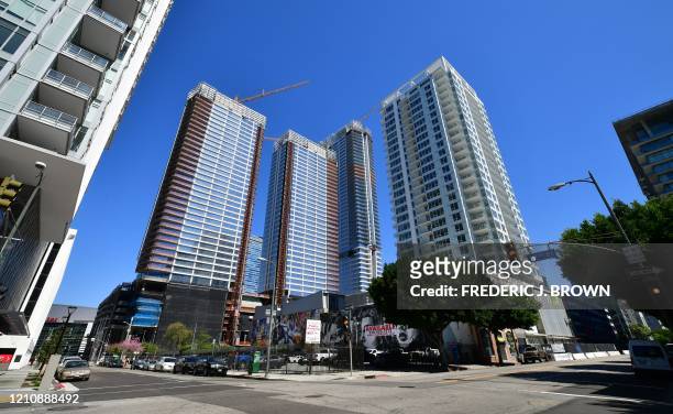 Deserted steets are seen around the Staples Center near towering blocks of highrise buildings for residential and commerical use in Los Angeles,...