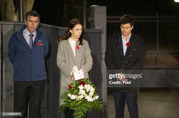 New Zealand Prime Minister Jacinda Ardern stands at dawn on the driveway of Premier House with her father Ross Ardern, left and partner Clarke...