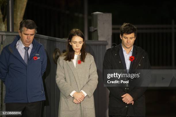 New Zealand Prime Minister Jacinda Ardern stands at dawn on the driveway of Premier House with her father Ross Ardern, left and partner Clarke...