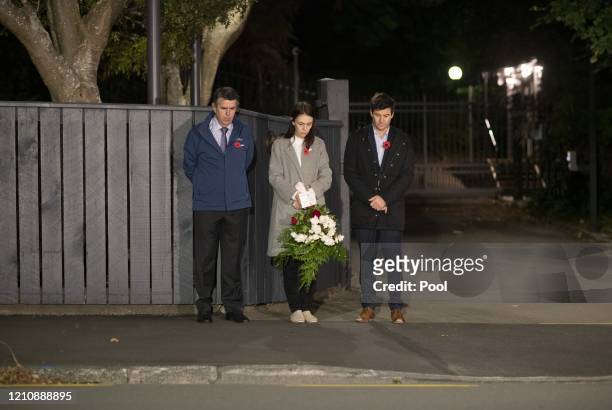 New Zealand Prime Minister Jacinda Ardern stands at dawn on the driveway of Premier House with her father Ross Ardern, left and partner Clarke...