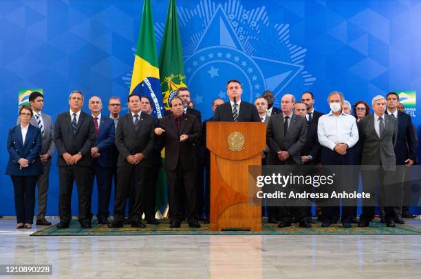 President of Brazil Jair Bolsonaro , accompanied by Ministers of State, speaks during a press conference after the resignation of Minister of Justice...