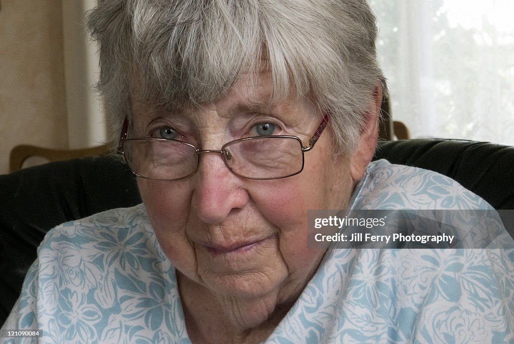 Woman looking over her glasses