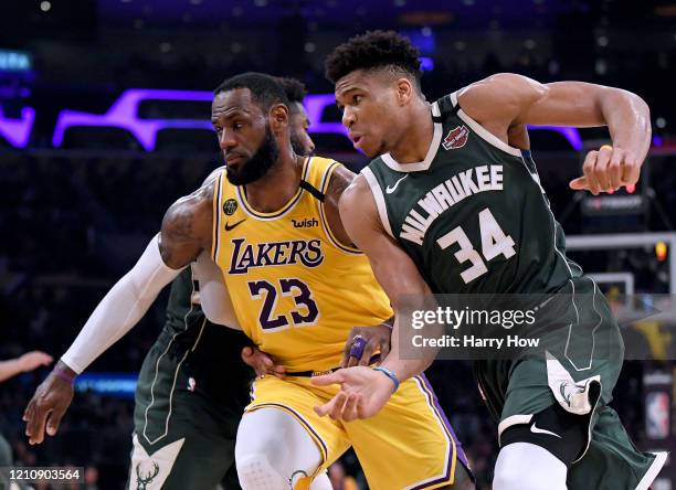 Giannis Antetokounmpo of the Milwaukee Bucks attempts to get open as LeBron James of the Los Angeles Lakers defends during the third quarter at...