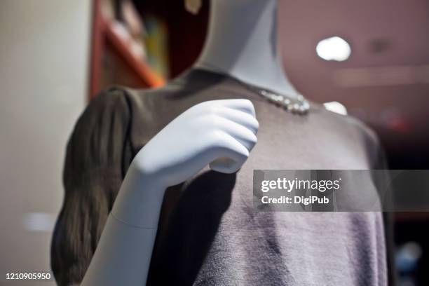 female like mannequin, hand over breast - mannequin arm stock pictures, royalty-free photos & images