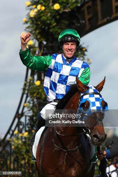 Jockey John Allen returns to scale on Fifty Stars after victory in race 8 the TAB Australian Cup during Melbourne Racing at Flemington Racecourse on...