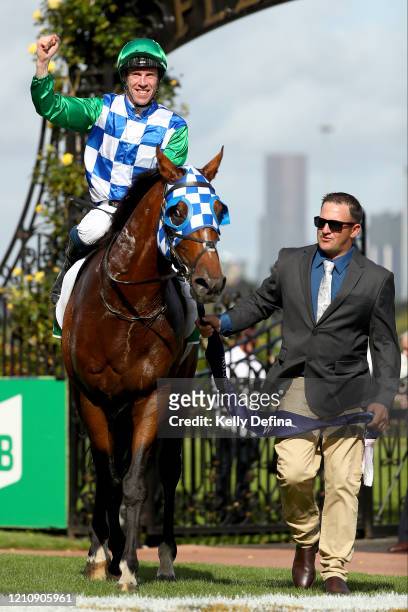 Jockey John Allen returns to scale on Fifty Stars after victory in race 8 the TAB Australian Cup during Melbourne Racing at Flemington Racecourse on...