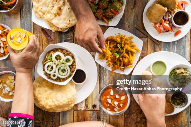 table top view of vegetarian food. - indian food on table stock pictures, royalty-free photos & images