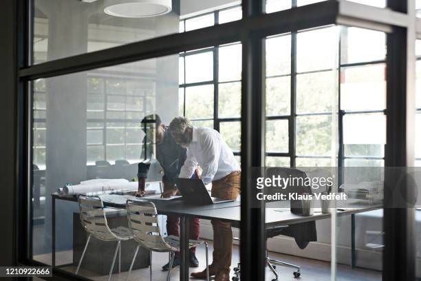 entrepreneurs working at desk in office - business finance and industry stock pictures, royalty-free photos & images