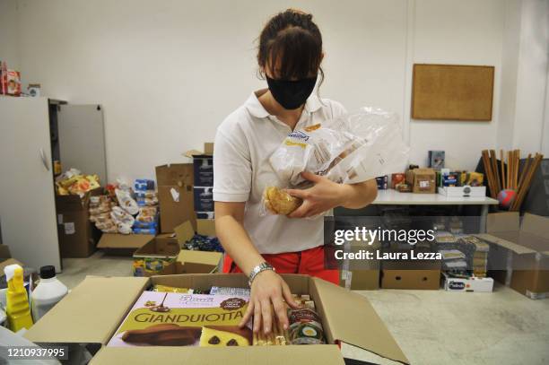 An SVS Pubblica Assistenza volunteer prepares solidarity food shopping bags for the coronavirus emergency on April 24, 2020 in Livorno, Italy. Italy...