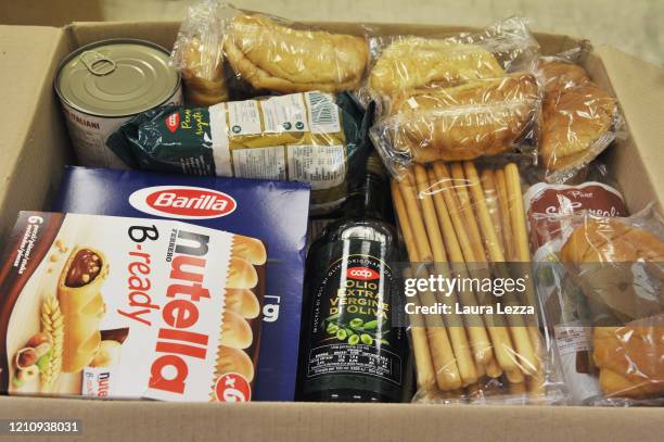 An SVS Pubblica Assistenza volunteer prepares solidarity food package for the coronavirus emergency on April 24, 2020 in Livorno, Italy. Italy will...