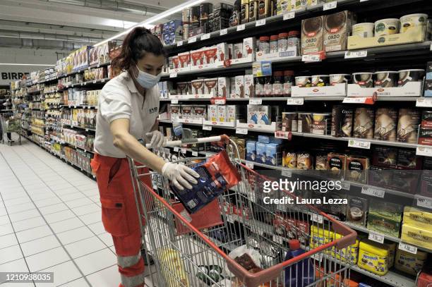 An SVS Pubblica Assistenza volunteer prepares solidarity food shopping bags for the coronavirus emergency on April 24, 2020 in Livorno, Italy. Italy...