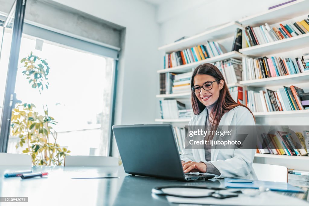 Woman physician prescribing medication