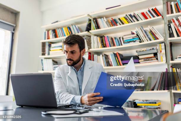 Male Gp Using Computer Photos and Premium High Res Pictures - Getty Images