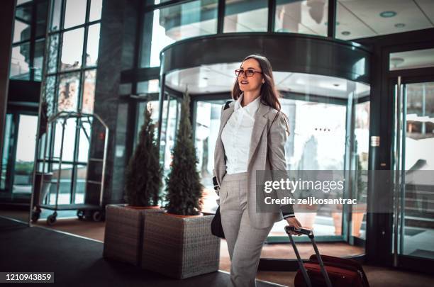 businesswomen  traveler in hotel  with phone - businesswoman hotel stock pictures, royalty-free photos & images