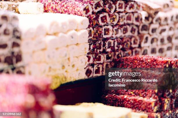 sweet food, dry fruit, baklava and oriental pastry roll in bazaar at historical centre of istanbul, turkey. - turkish delight stock-fotos und bilder