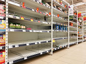 KAUNAS, LITHUANIA - FEBRUARY 29, 2020: Empty shelves in a Maxima supermarket. Shortages of goods during panic of Corona virus.
