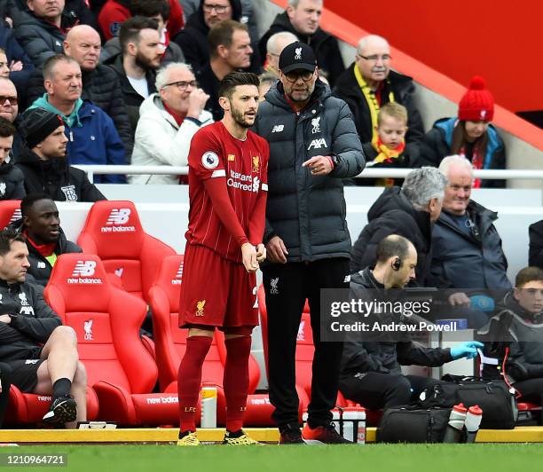 Jurgen Klopp manager of Liverpool talks to Adam Lallana of Liverpool during the Premier League match between Liverpool FC and AFC Bournemouth at...