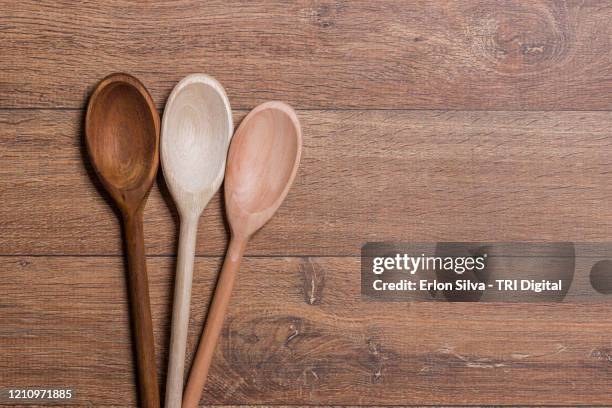 composition of wooden spoons with copy space for kitchen subjects background design - wooden spoon imagens e fotografias de stock