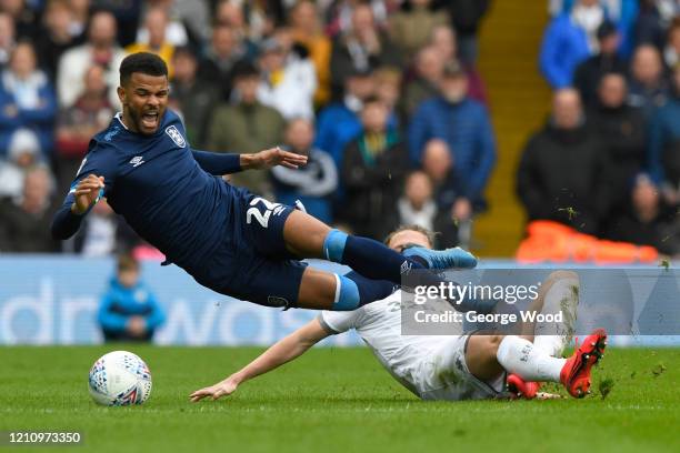 Fraizer Campbell of Huddersfield Town is tackled by Luke Ayling of Leeds Unitedduring the Sky Bet Championship match between Leeds United and...