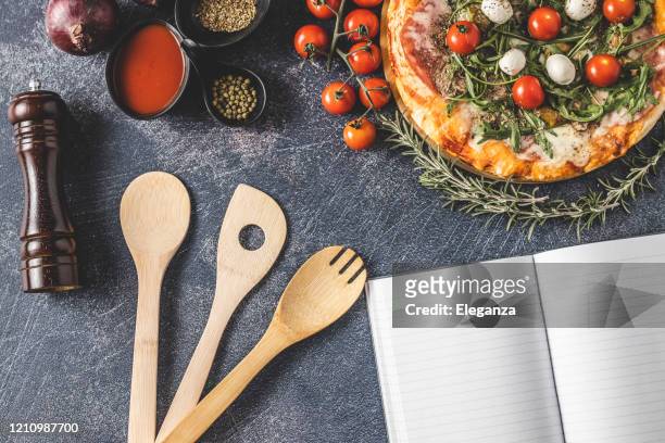 empty cookbook and pizza - rocket book stock pictures, royalty-free photos & images