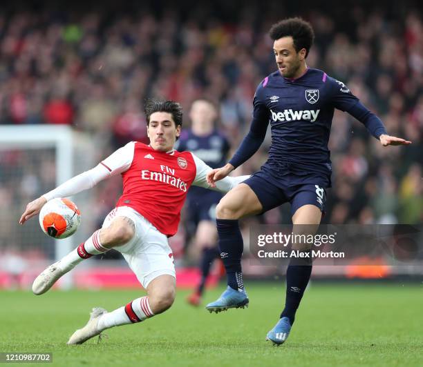 Felipe Anderson of West Ham United is challenged by Hector Bellerin of Arsenal during the Premier League match between Arsenal FC and West Ham United...