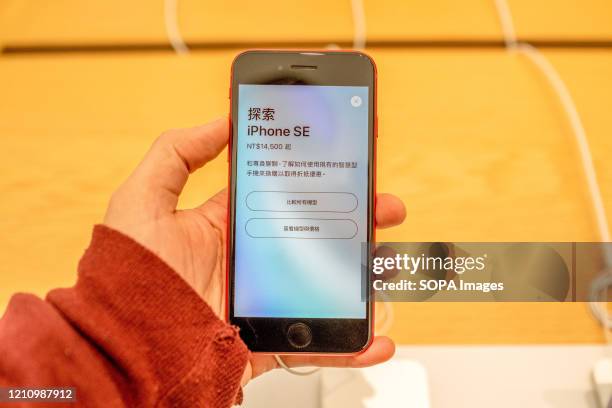 Smartphone iPhone SE red version, seen displayed at an American multinational technology company, Apple store. Apple launched sales of its latest...