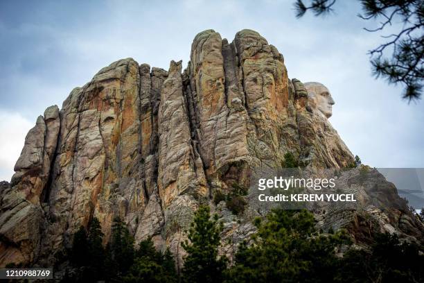 The face of US President George Washington at Mount Rushmore National Memorial on April 23 in Keystone, South Dakota. - The steep roads that wind...